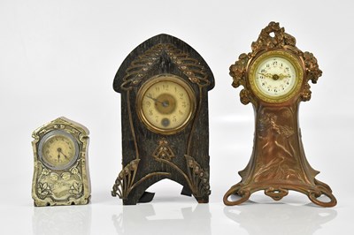 Lot 173 - An Art Nouveau bronzed spelter mantel clock...