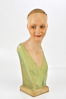 Lot 170 - An Art Deco painted celluloid and plaster bust...