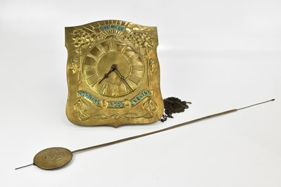 Lot 87 - An Arts and Crafts sheet brass wall clock...
