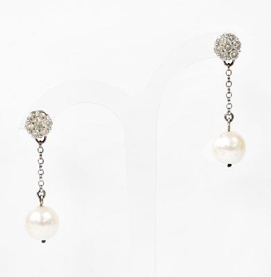 Lot 1372 - A pair of 9ct white gold diamond cluster...