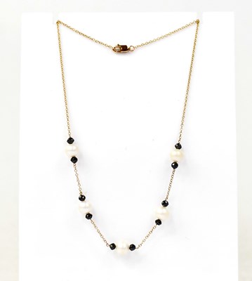 Lot 1448 - A 9ct yellow gold fine chain link necklace set...