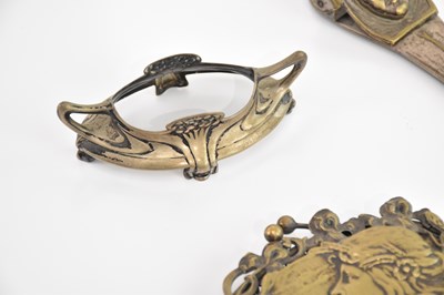 Lot 127 - ATTRIBUTED TO WMF; an Art Nouveau brass lady's...