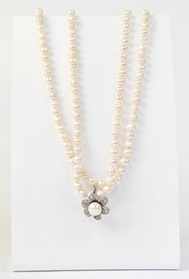 Lot 1467 - A continuous pearl necklace with moveable...