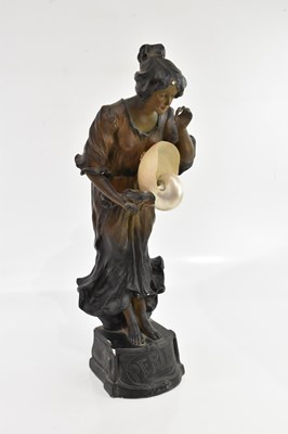 Lot 105 - An Art Nouveau painted plaster figural lamp...
