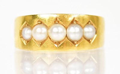 Lot 1302 - An 18ct yellow gold ring set with five pearls,...