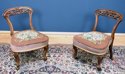 Lot 2866 - A pair of Victorian carved walnut framed...