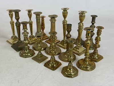 Lot 184 - Six pairs of 19th century brass candlesticks...
