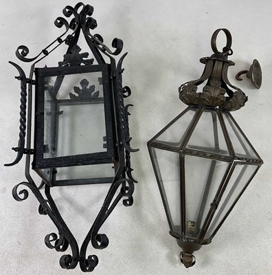 Lot 635 - A wrought iron and clear glass hall lantern,...