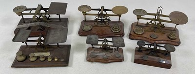 Lot 107 - Six sets of brass wooden based postal scales.