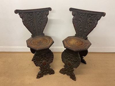 Lot 737 - A pair of Italian carved carved hall chairs,...