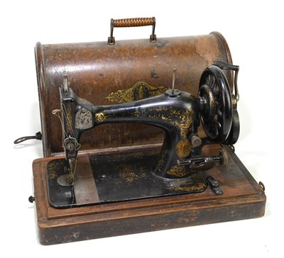 Lot 172 - SINGER; a manual sewing machine, cased.