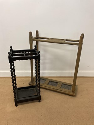 Lot 722 - A rustic wooden umbrella stand with integrated...