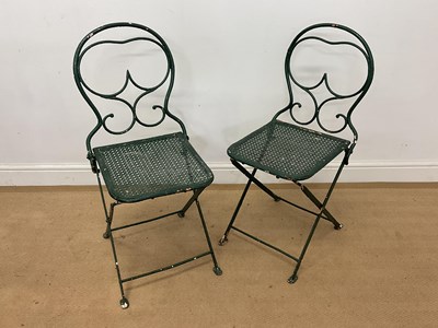 Lot 687 - A pair of painted folding metal garden chairs.