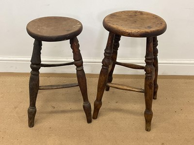 Lot 738 - Two 19th century elm topped stools on turned...