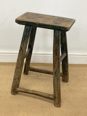 Lot 792 - A rustic wooden painted stool with original...