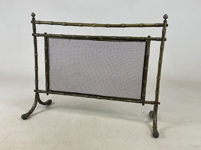 Lot 182 - An Aesthetic Movement faux bamboo brass fire...