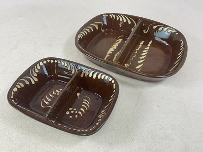 Lot 275 - A large 19th century treacle glaze slipware...