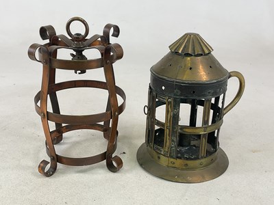 Lot 647 - An Arts and Crafts brass cylindrical candle...