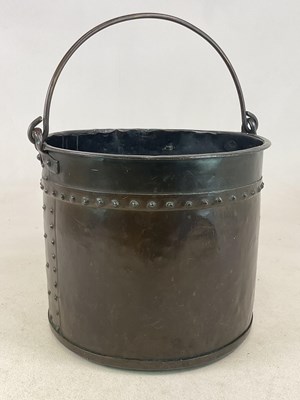Lot 219 - A large copper swing handled bucket with rivet...