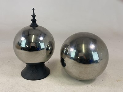 Lot 55 - Two similar silvered glass balls, larger...