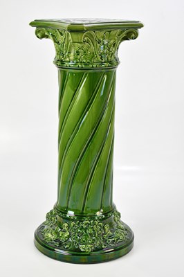 Lot 1678 - WOODLESFORD POTTERY; a green jardinière stand,...