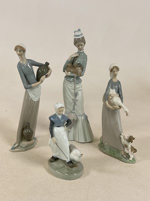 Lot 260 - ROYAL COPENHAGEN; a goose girl figure and...