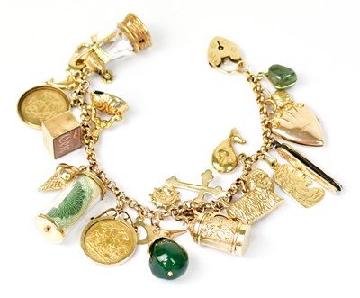 Lot 1405 - A 9ct yellow gold charm bracelet with...