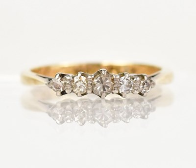 Lot 1294 - An 18ct gold ring with five diamonds set in...