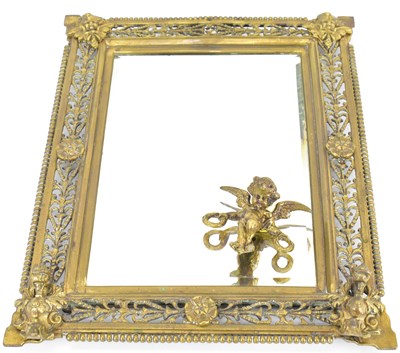 Lot 75 - An early 20th century brass bevel edge mirror...