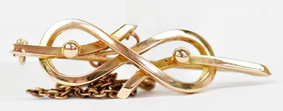 Lot 1391 - A 15ct yellow gold bar brooch in the form of a...