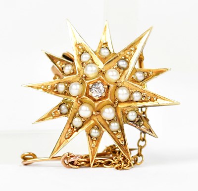 Lot 1389 - An 18ct yellow gold star-shaped brooch set...