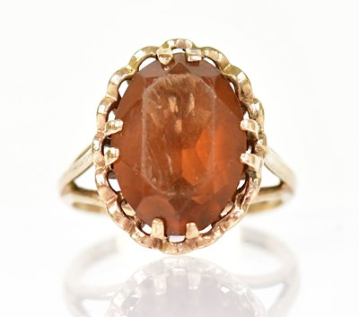 Lot 1344 - A 9ct yellow gold ring set with a large...
