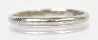 Lot 1257 - A platinum narrow wedding band, size N, approx....