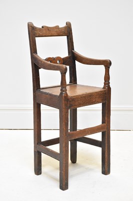Lot 1087 - A late George III vernacular oak child’s high...