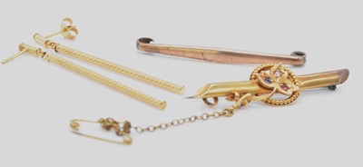 Lot 505 - A 15ct yellow gold diamond, ruby and sapphire...