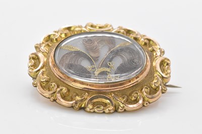 Lot 493 - A Victorian yellow metal mourning brooch, with...