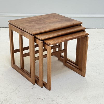 Lot 1006 - A mid century nest of three oak tables, height...