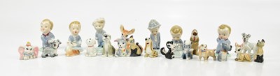 Lot 1612 - WADE; six ceramic figures of boys, the tallest...