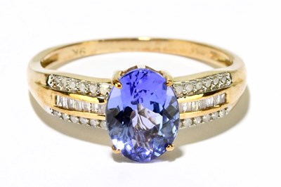 Lot 1227 - A 9ct yellow gold tanzanite and diamond ring,...