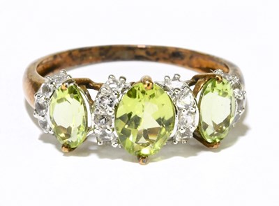Lot 1230 - A 9ct yellow gold peridot set dress ring, size...