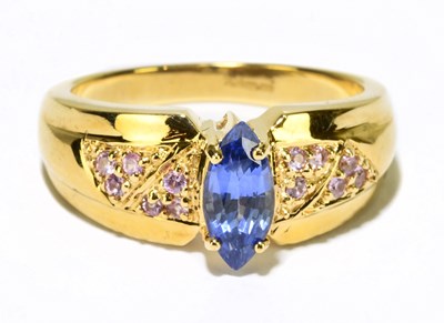 Lot 1128 - An 18ct yellow gold sapphire dress ring, size...