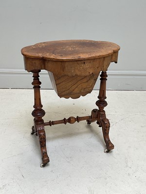 Lot 1197 - A Victorian inlaid walnut sewing table, the...