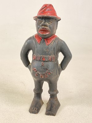 Lot 59 - A reproduction cast iron 'GIVE ME A PENNY'...