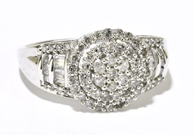 Lot 1205 - A 9ct white gold diamond cluster ring, size R,...