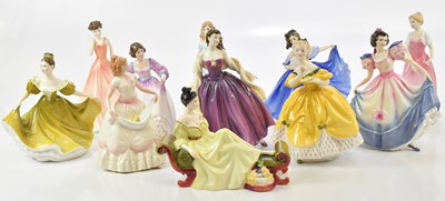Lot 2450 - ROYAL DOULTON; a collection of eleven figures...
