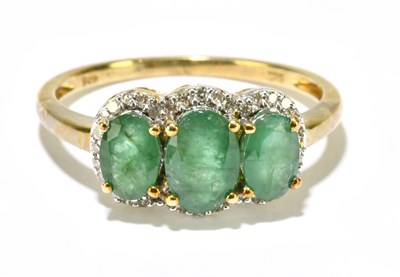 Lot 1225 - A 9ct yellow gold emerald and diamond ring,...