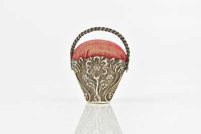 Lot 2098 - A Victorian white metal pin cushion in the...