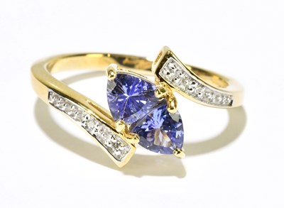 Lot 1167 - A 14ct yellow gold diamond set crossover ring,...
