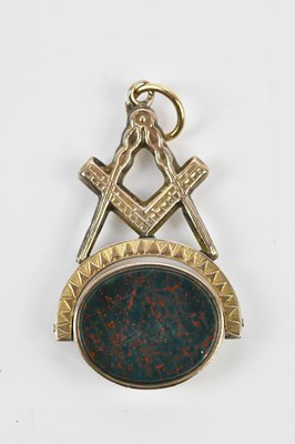 Lot 5 - A yellow metal Masonic swivel fob set with...