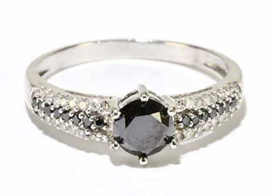 Lot 1214 - A 9ct white gold sapphire and diamond ring,...